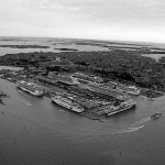 837 aerial view Tronchetto grandi navi cruise ships gazzettino A view of the docks at Tronchetto. As you see, seven assorted ships can fit in here at any one time, though these is space for smaller ones (yes, there are smaller ones) at the Zona Marittima nearby. Discussion is underway to expand the dock area.