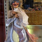 IMG_5586 befana One of the squillion Befanas that swarmed the stores. Snaggly teeth: check. Broomstick: check. Stockings crammed with candy: check. She's good to go.
