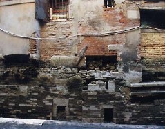 It's not hard to find scenes like this, or worse, below the waterline. Here, a house near Campo Santa Maria Formosa. And just imagine how happy the owners of this house must be. Who pays for repairs is a saga unto itself. (Credit: Italia Nostra Venice Chapter)