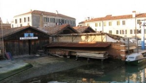 Tramontin and Sons are one of the few squeri still building gondolas in Venice, and their workshop shows the traditional setup, from the wooden-chalet workshop to the ramp sliding down into the water.