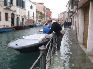 This is the kind of image that is often presented as "the end is nigh" for Venice.  As you see, the man is having hysterics.