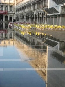 Yes, the water is rising in the Piazza San Marco.  But the owner of the cafe clearly is not too concerned, otherwise he wouldn't have bothered setting up all those chairs and tables.