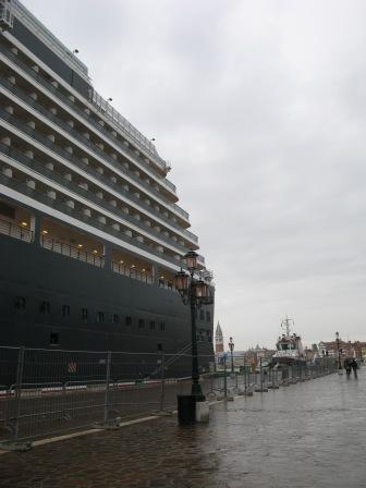 You may think that the ship's size relative to the campanile of San Marco (325 feet tall) is an optical illusion.  Not by much.  "Queen Victoria" is TK feet tall.