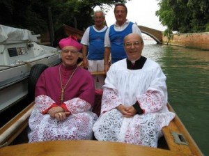 We rowed the auxiliary bishop and the parish priest to church for the big mass on Sunday morning.