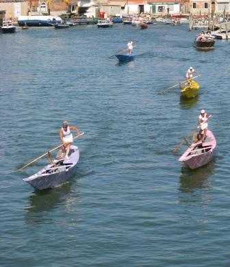 The women on pupparinos are about 60 seconds from the finish line and it looks like the pink boat may still have a chance to overtake the white (2009).