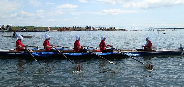 A crew of hardy Dutch ladies who I thought, ignorantly, had escaped from the Daughteres of Charity of St. Vincent de Paul. But closer reflection makes it obvious that they have ingeniously modified their traditional headgear to be boatworthy.