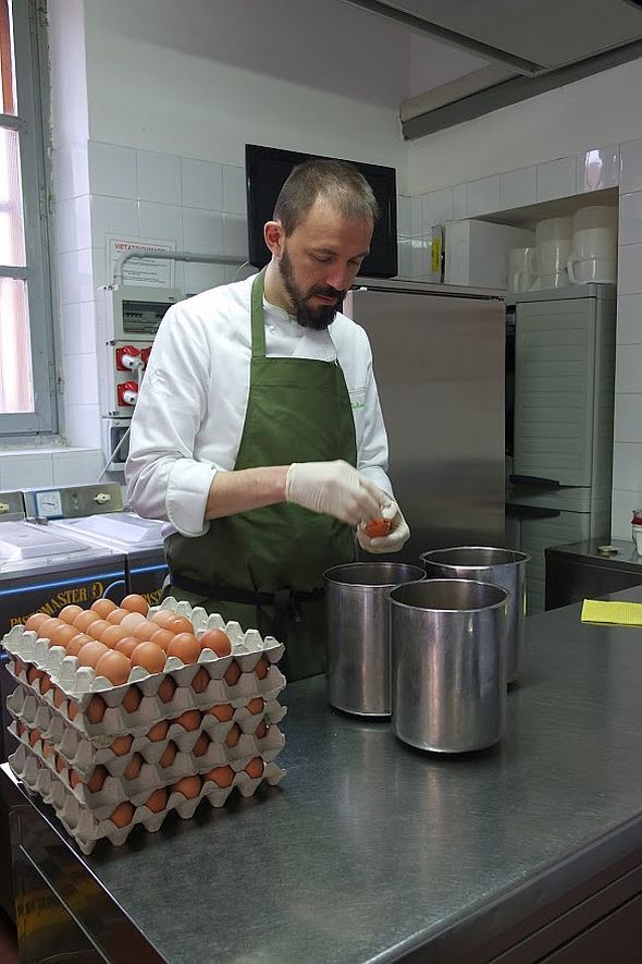 Separating eggs by hand. The yolks act as an emulsifer, the whites are often destined for a sorbetto. 